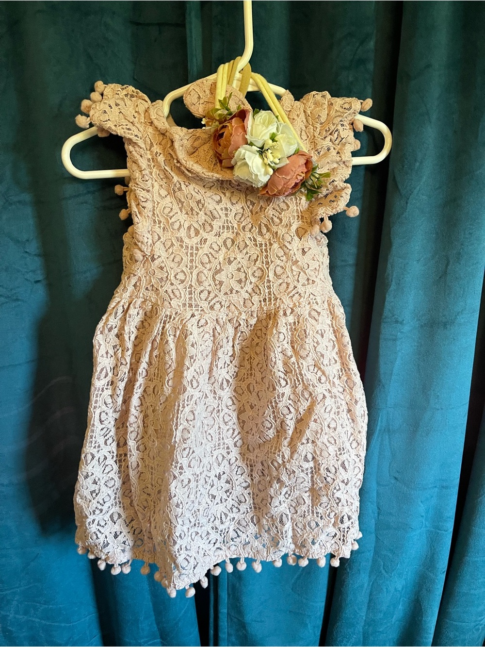 Pink lace dress with floral headband and bow head band.